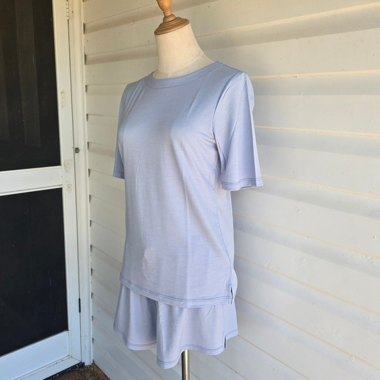 Dusty Blue Elbow length merino tee on mannequinn